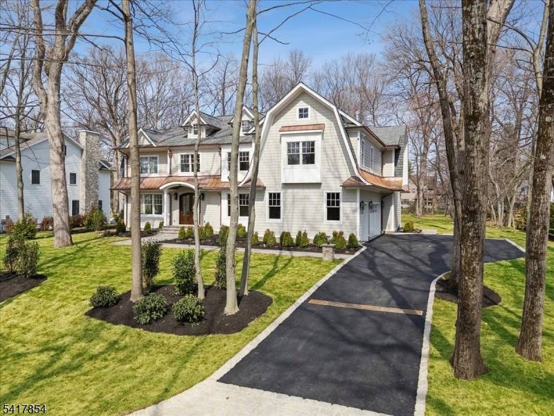 Experience timeless elegance in this exceptional Dutch Colonial offering 7 bedrooms, 7.