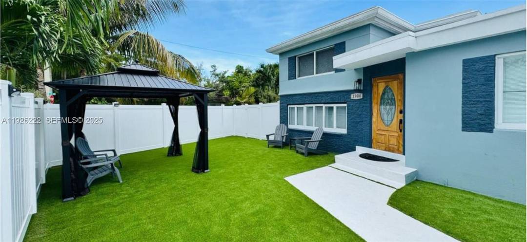 This unique multifamily property offers two separate residences on a spacious corner lot, blending style, comfort, and investment potential.