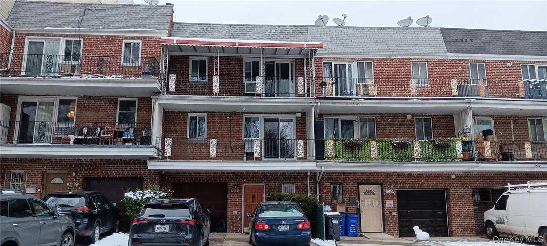 Large three bedroom 1. 5 Bathroom third floor apartment with a large balcony and a designated parking spot in the heart of Kew Gardens.