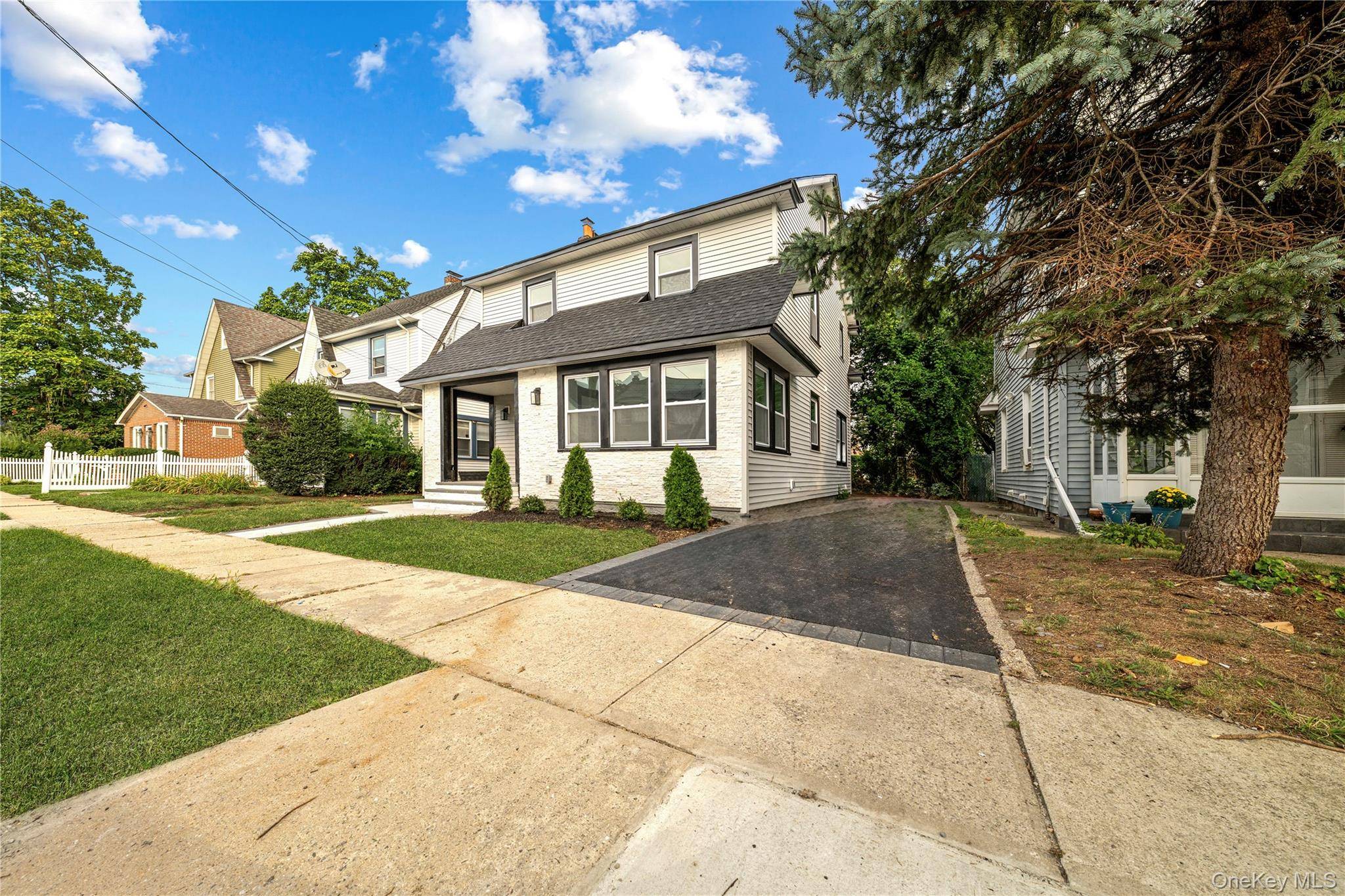 Beautiful renovated Colonial offering Modern open layout with designer finishes style, comfort, and convenience in one of Long Island s most sought after locations.