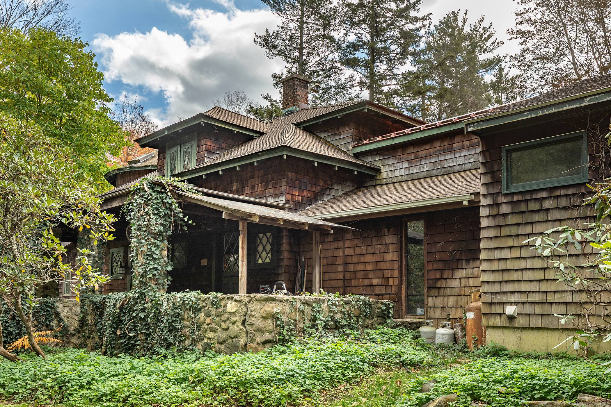 Located near the prestigious Mayflower Inn and just minutes from the Washington Green in an area of many fine estates, this 1890's Barn style home with it's silo and 1970's ...