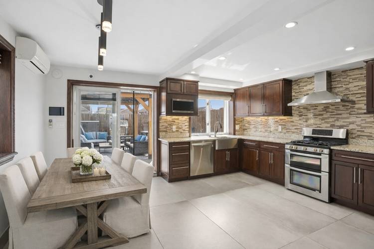 Welcome to 84 Gotham Avenue, a move in ready, waterfront home in Gerritsen Beach offering modern comfort, quality craftsmanship, and direct access to the water.