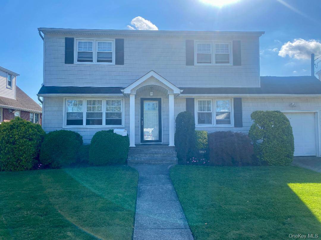 BEAUTIFUL EXPANDED CAPE, 5 BEDROOMS, 2 FULL BATHS, ATTACHED GARAGE, FULL BASEMENT EAST MEADOW SCHOOLS WTC CLARKE HS GORGEOUS YARD WITH MATURE PLANTINGS