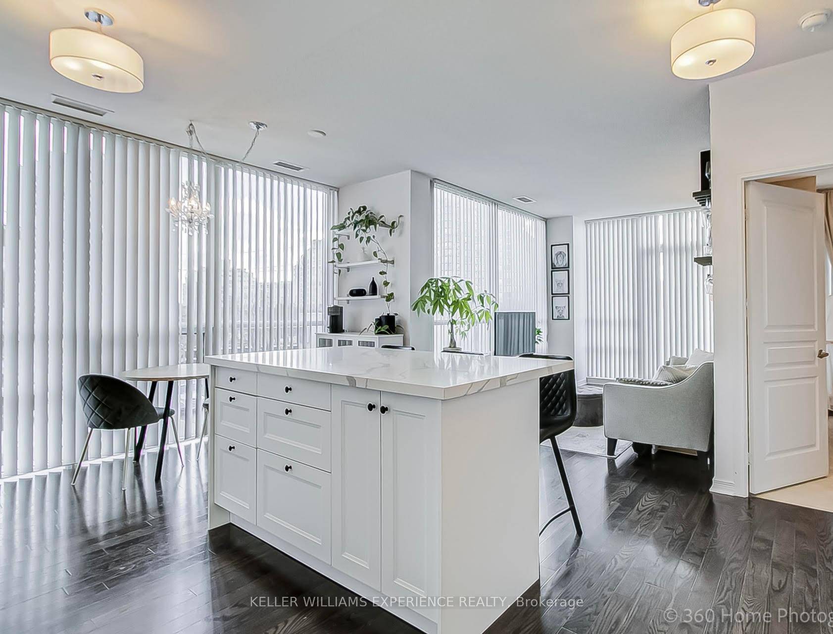 This bright corner suite offers a 1 bedroom, 1 bathroom layout with in suite laundry, featuring a unique open concept design, 9ft ceilings, wood floors, and floor to ceiling windows ...