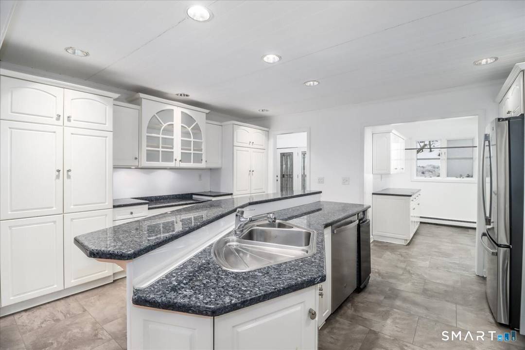 Tucked away at the end of a peaceful country road, this solid Contemporary Colonial offers the perfect blend of privacy and convenience.