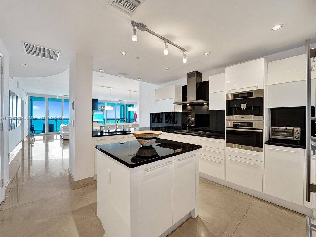 Wow ! Perfect 10 ! Enter this Beachfront Palace in the Sky through private elevator foyer and immediately see direct ocean views throughout !