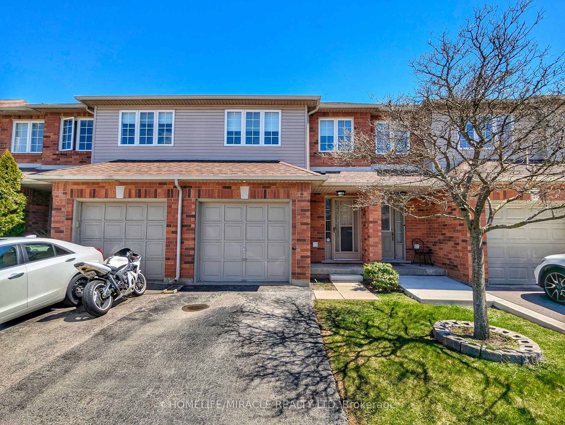 Gorgeous three bedroom townhouse featuring an open concept main floor with apowder room and oak kitchen with stainless steel appliances, walkout to amanicured backyard, and a finished basement.