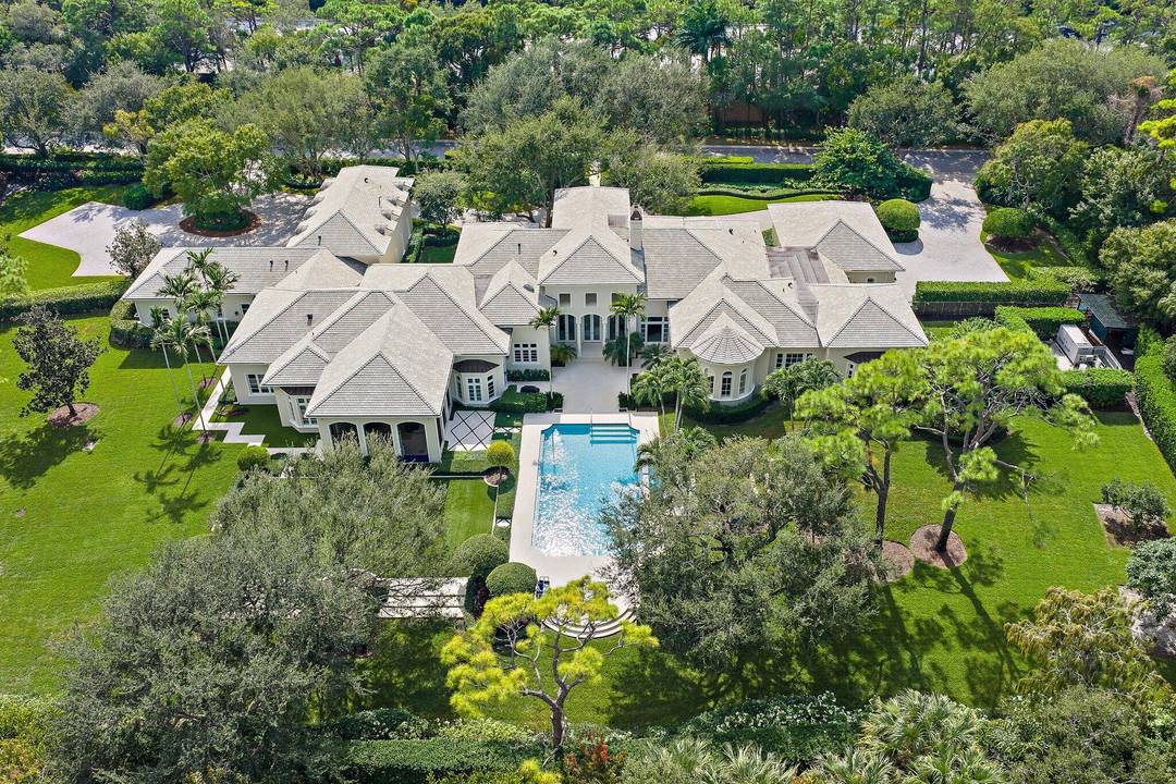 Extraordinary custom estate home built on one of the largest lots in The Bears Club.