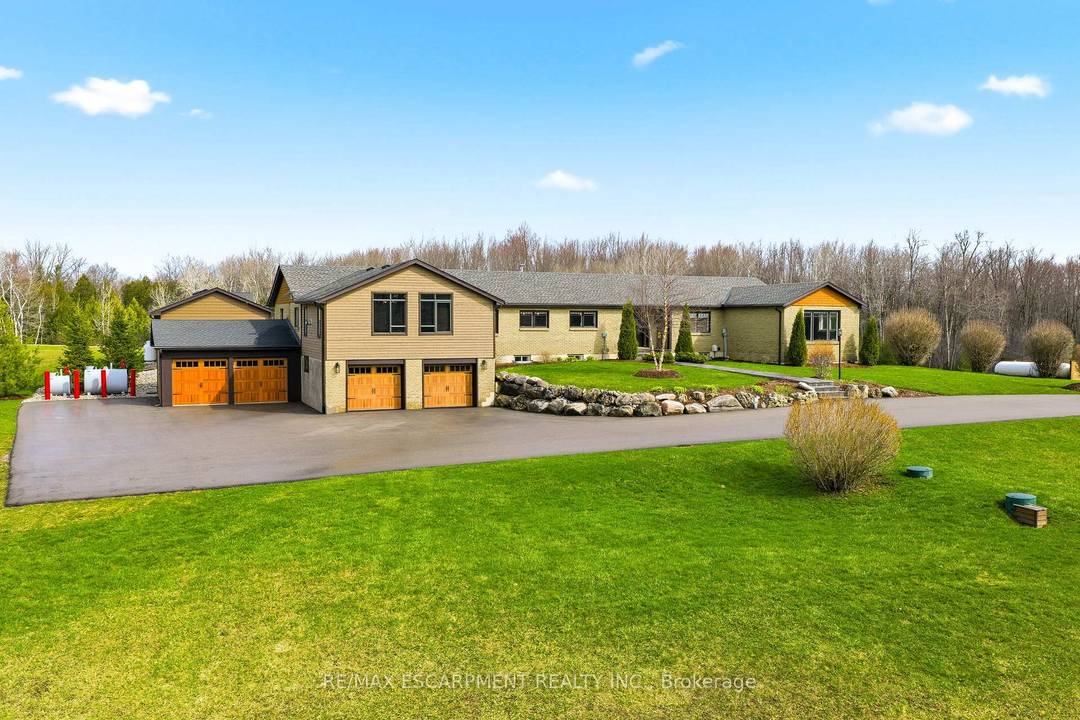 Welcome to 1371 Concession 10 W set at the end of a quiet road on 14 acres of private, usable land.