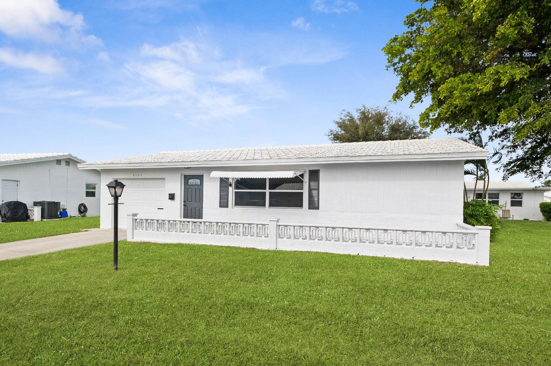 Step into this superbly renovated Challenger model on a corner lot in Leisureville.