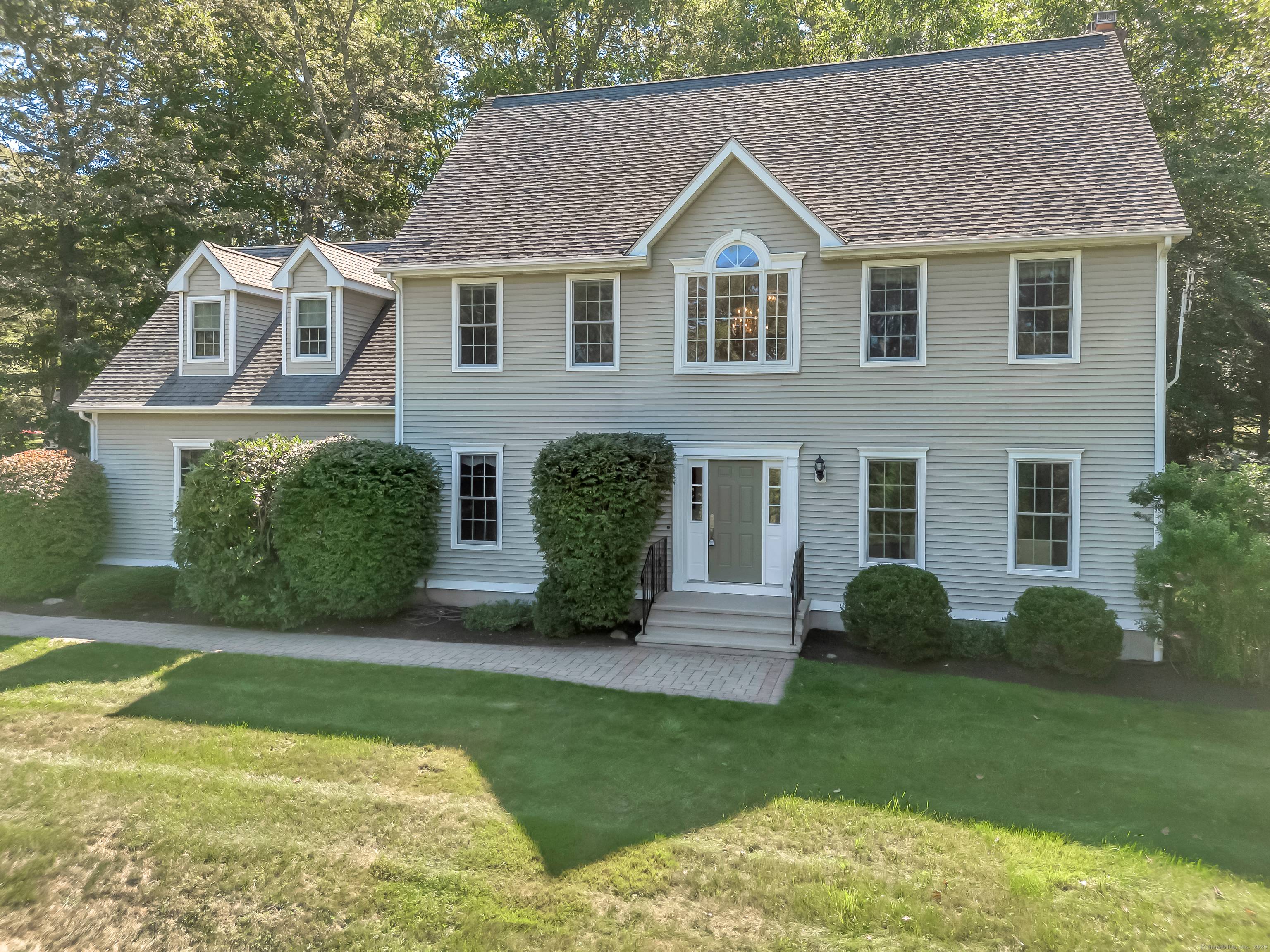 This Glastonbury home boasts a park like setting with four spacious bedrooms, two and a half bathrooms, open foyer, family room with fireplace and granite countertops in the kitchen.