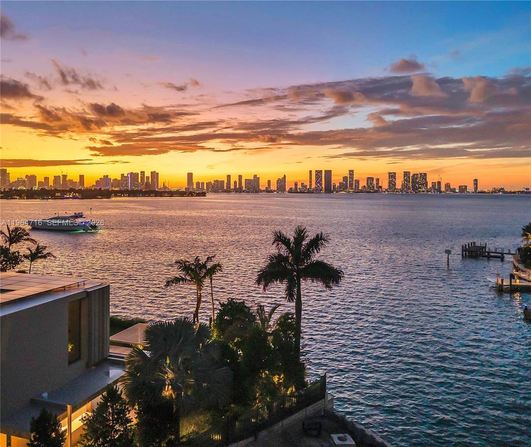 Extraordinary Villa Tramonto on gated Sunset Island 4 with sublime sunset views and coveted west exposure.