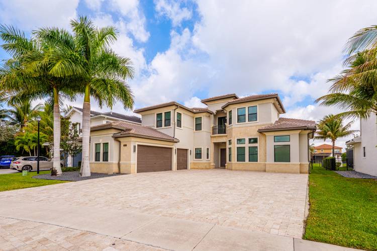 Welcome to 9801 Rennes Lane in the prestigious Seven Bridges community of Delray Beach.