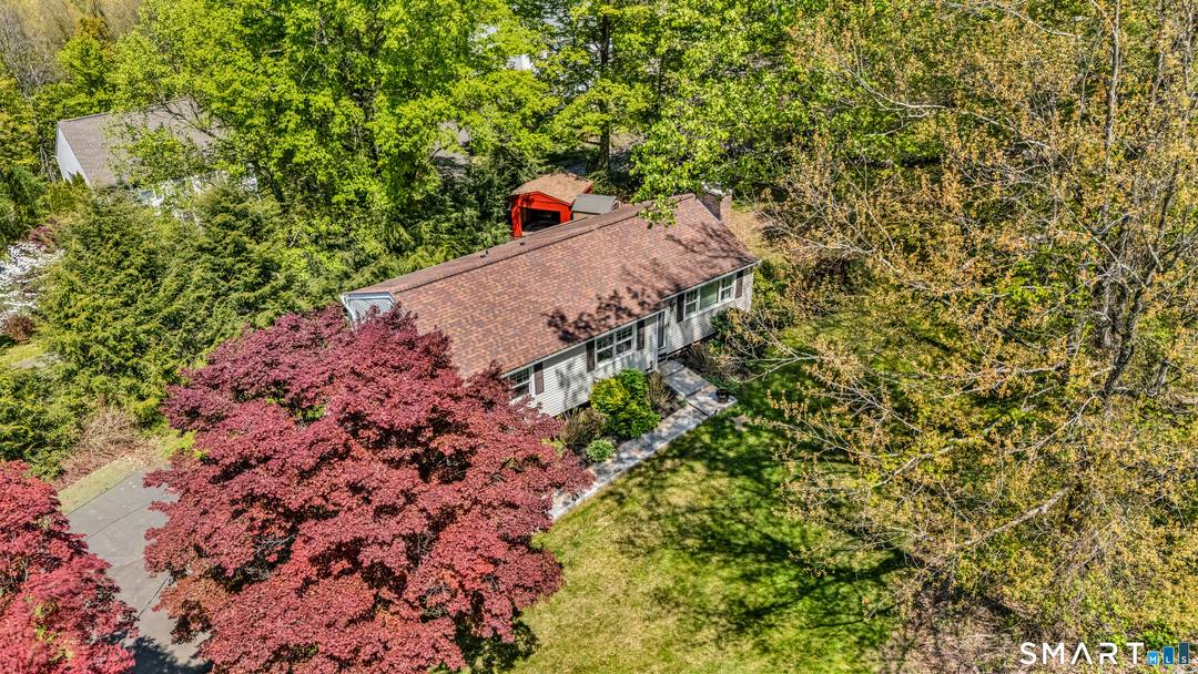 Welcome to 51 Chipmunk Trail, a charming Sandy Hook ranch nestled on a quiet, private road surrounded by mature landscaping and natural beauty.