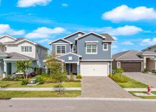 Experience unparalleled luxury in this exquisite Huntington model by GL Homes, a true entertainer's dream offering 5 bedrooms, 4.