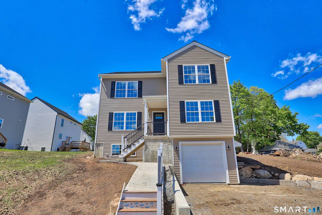 Beautiful west side new construction colonial, with open floorplan, stainless steel appliance kitchen with center island, open to living room and dining area with slider to level back yard and ...