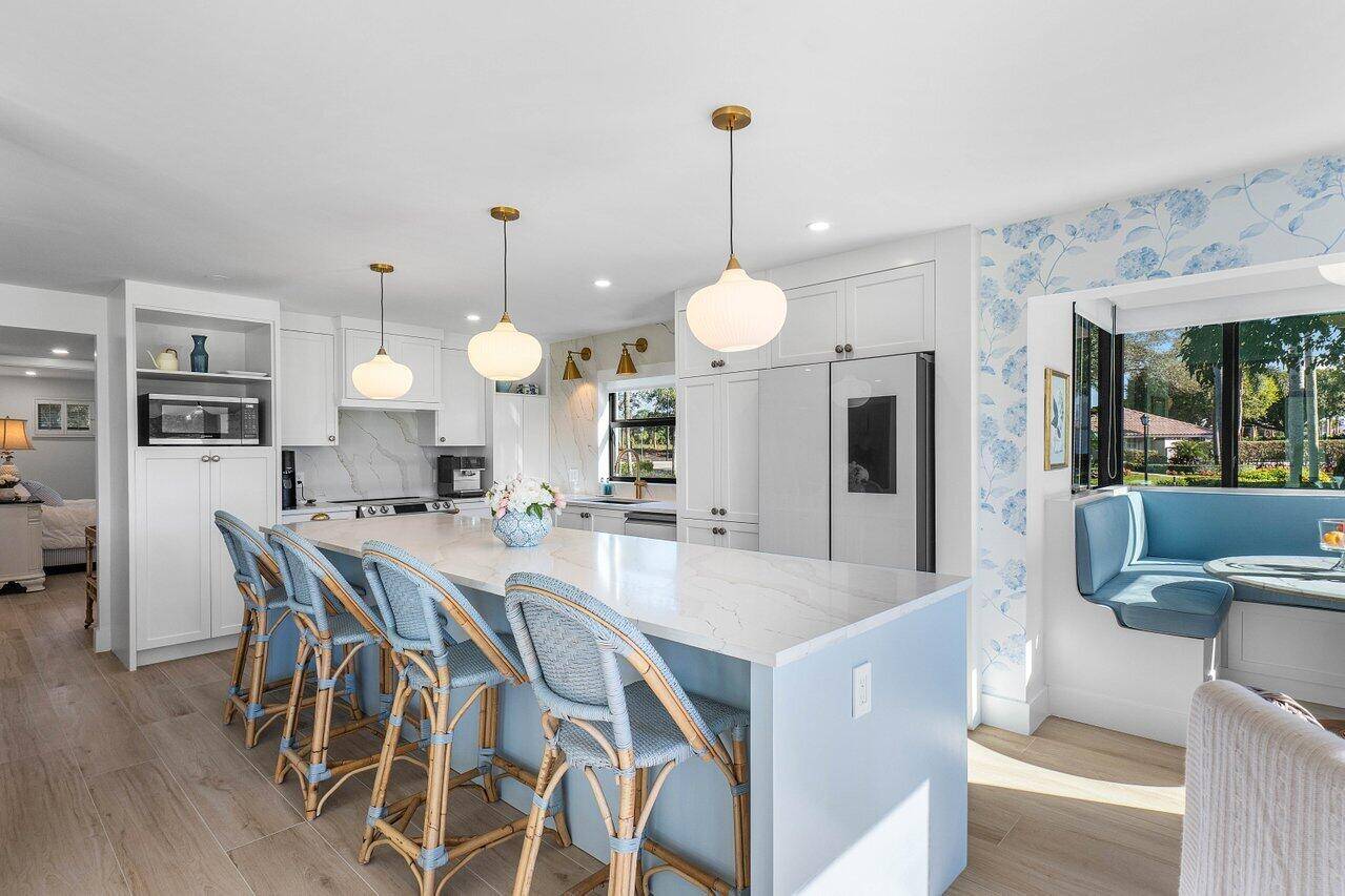 Stunning golf course views from this completely, beautifully renovated 2 bedroom, 2 bathroom first floor residence, offering a serene private club setting.
