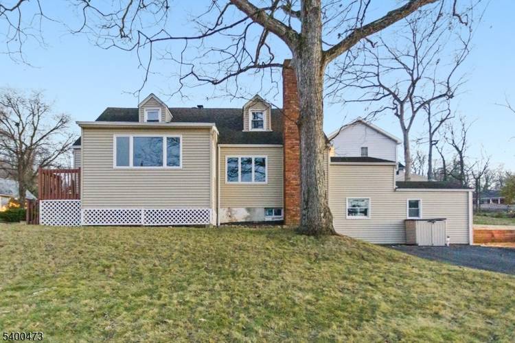 Welcome home to this beautifully renovated expanded Cape Cod, perfectly nestled in one of Watchung's most treasured settings directly across from the peaceful waters of Watchung Lake.