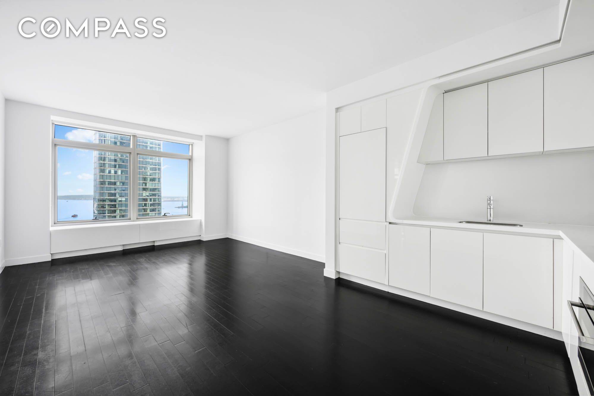 Live Above It All at 123 Washington Street, Penthouse PH53G Discover elevated living in this stunning 1 bedroom, 1 bathroom penthouse perched atop the W Residences in the heart of ...
