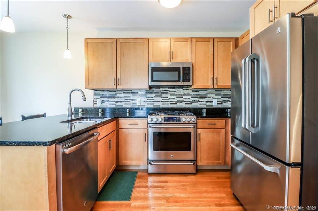 Fern style three level Copper Square townhouse ready for its next owner.