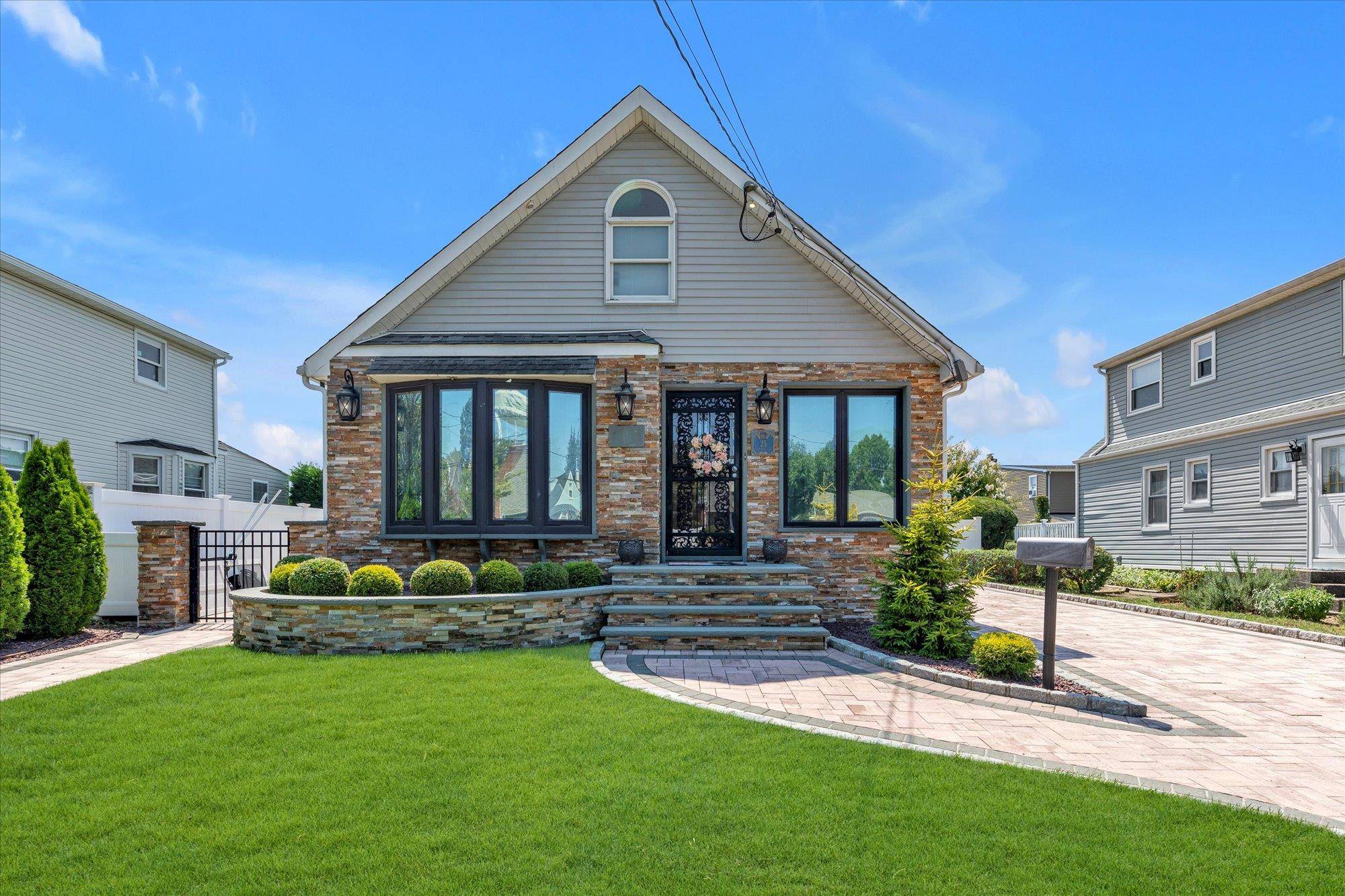 Completely Updated Cape with Stone Front, Tree Lined Street In The heart of Westbury with Carle Place School District, New Kitchen, New Bathrooms, New Floors, Recessed Lighting, Freshly Painted, In ...