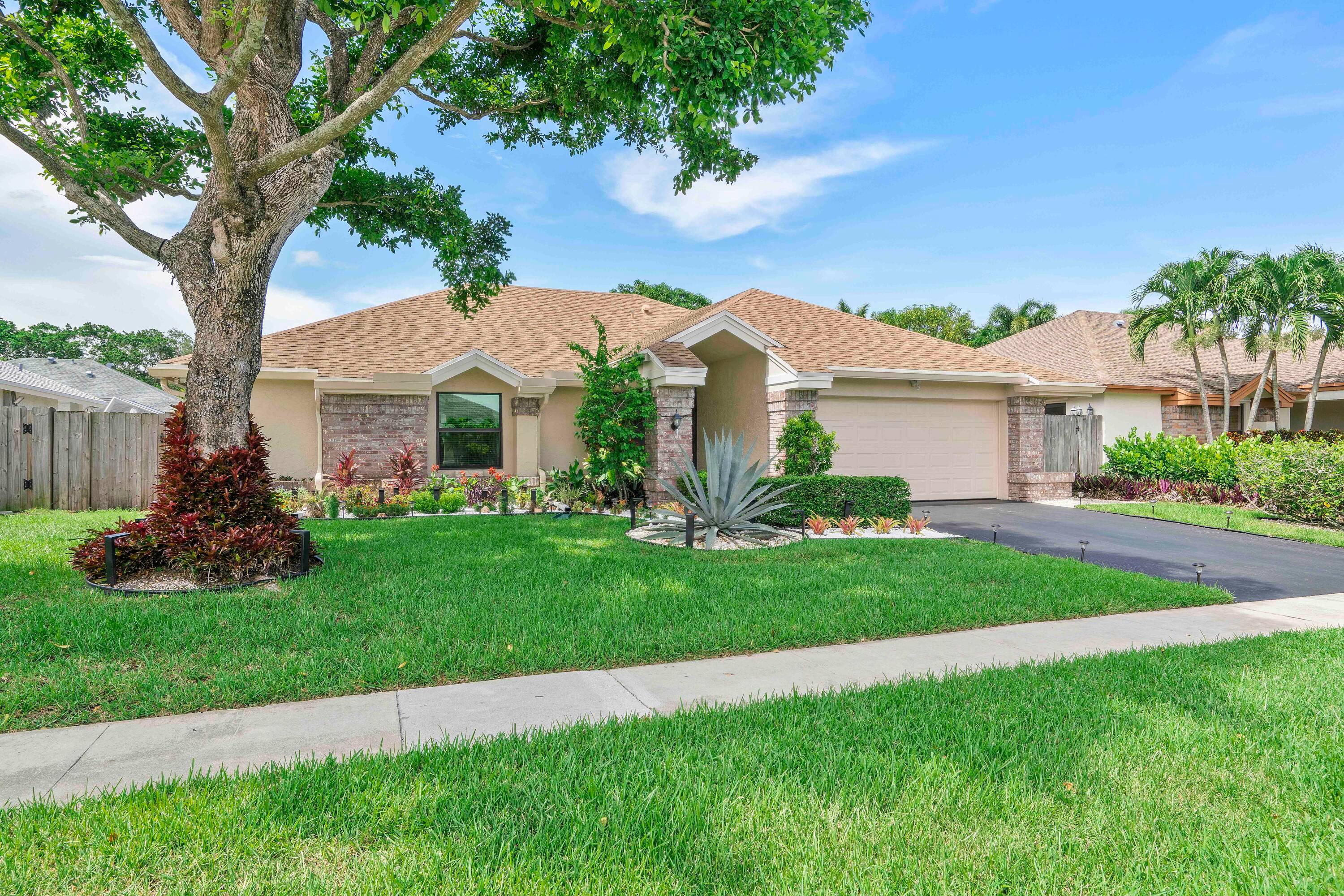 Welcome to your private oasis in the heart of West Boca !