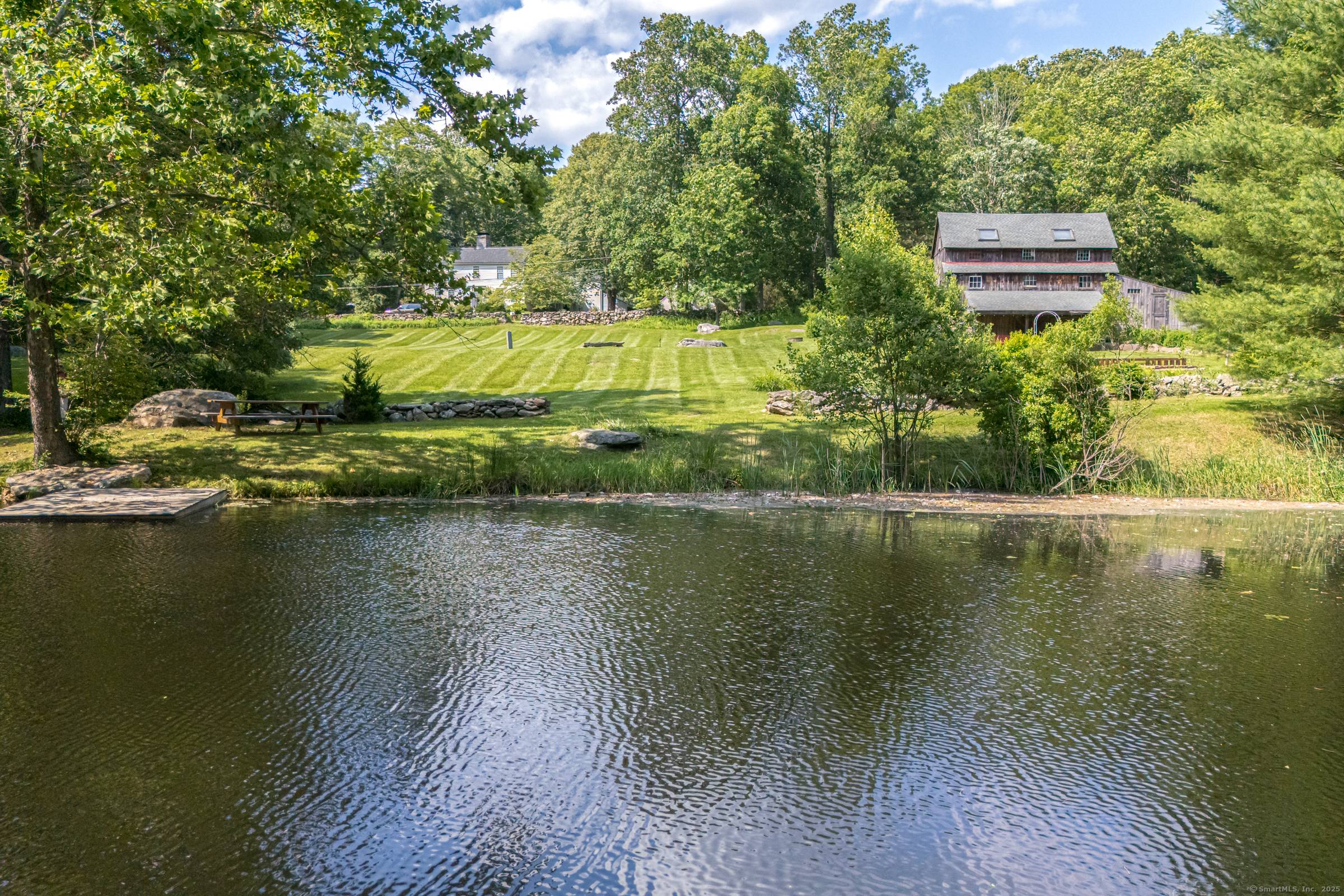 Welcome to 85 Potash Hill in Sprague, CT a rare and remarkable property offering two unique homes nestled on 2 parcels equalling 32 total pristine park like acres.