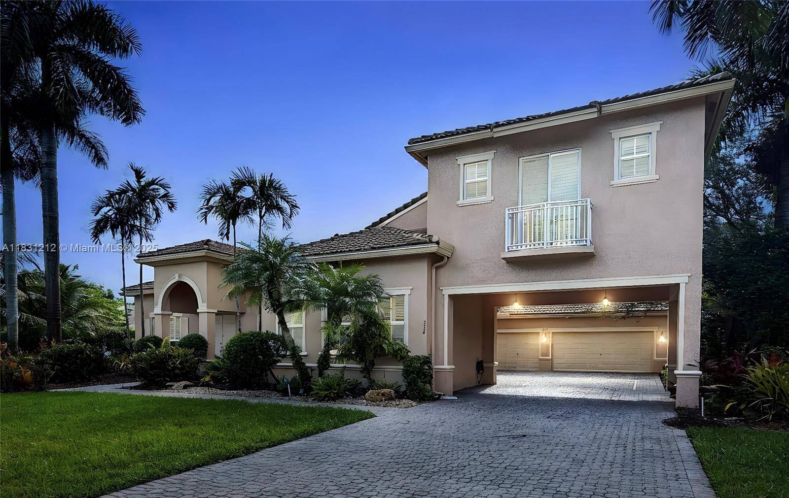 Experience refined luxury in this exquisite estate home with panoramic lake views and lush tropical landscaping surrounding a resort style pool.