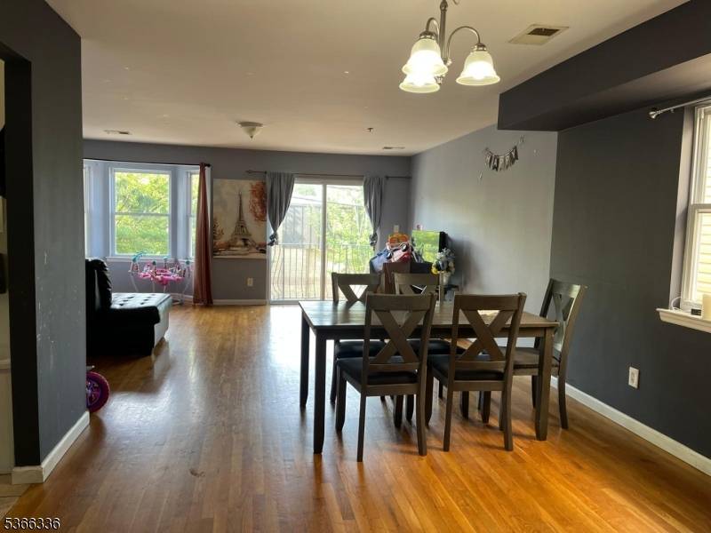 This exquisite Three Family Home property offers the luxury and convenience, featuring two private driveways leading to private garage and a beautifully gardened and paved backyard patio perfect for relaxation.