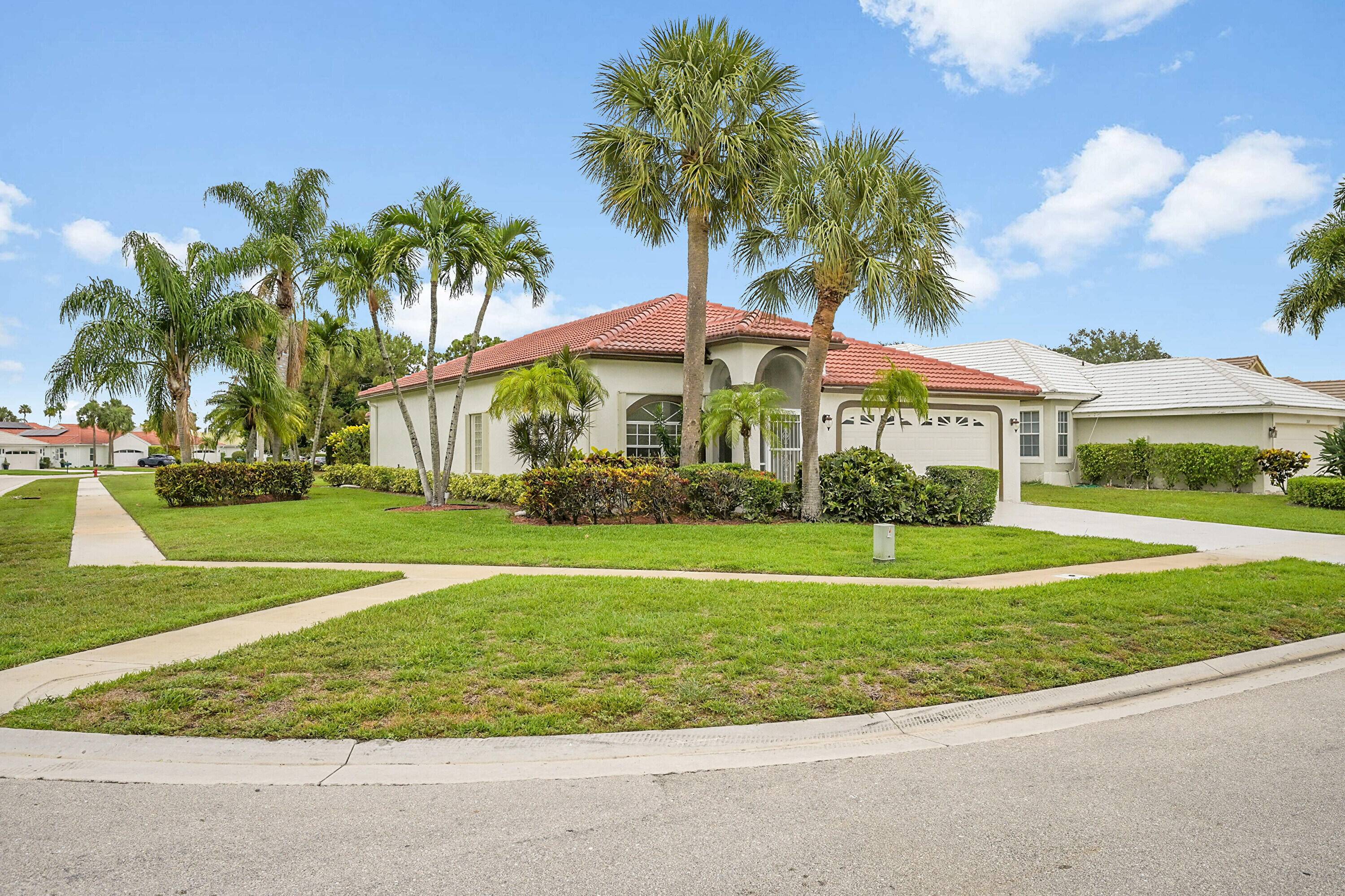 NEW ROOF AND AIR CONDITIONERS Look no further for your dream home in this desirable community in the heart of Wellington !