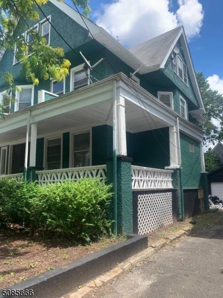 Large 3 story Legal single family, was being used in as a 3 unit, separate entrances, with finished attic, 2 car detached garage.