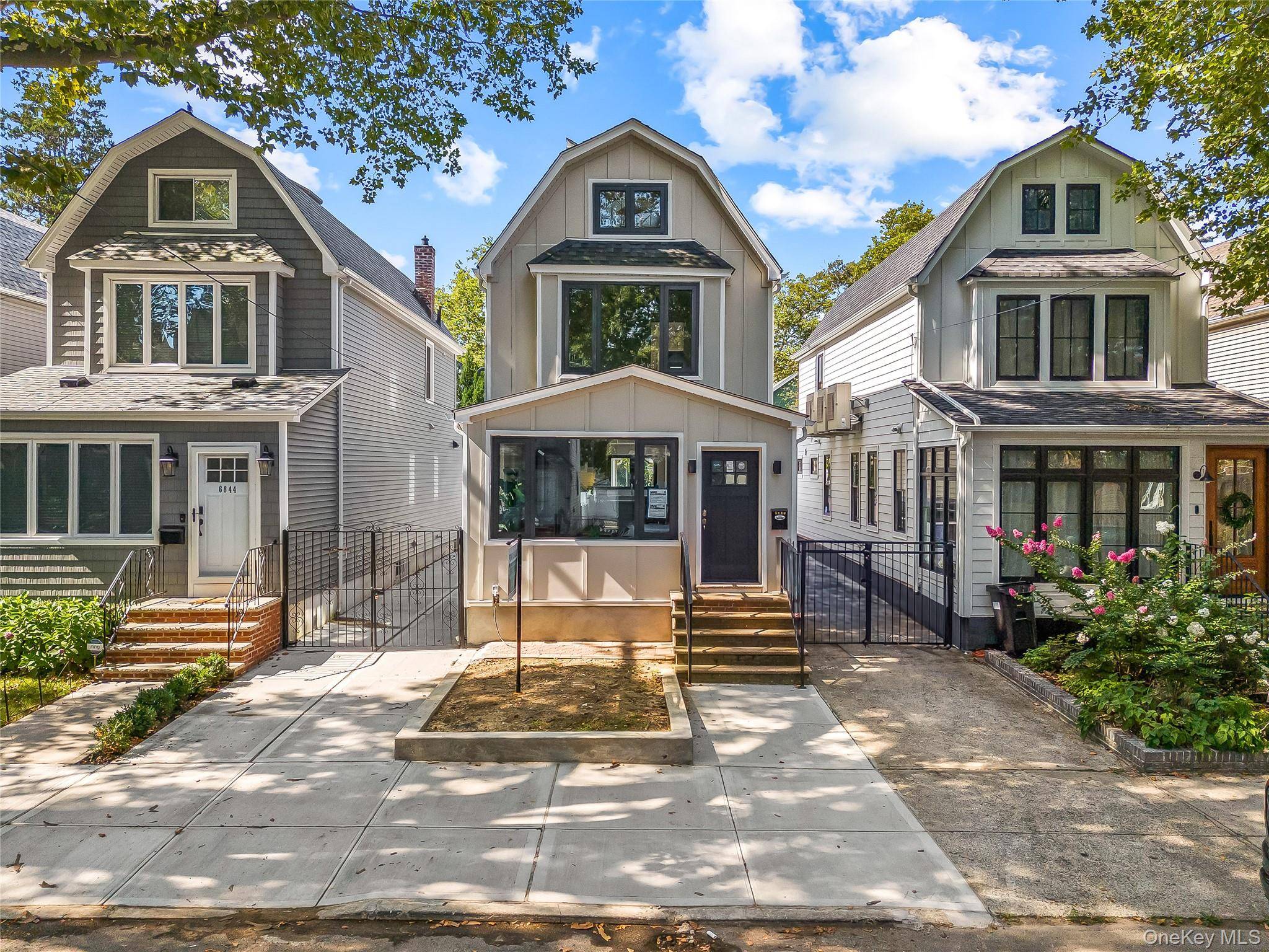A meticulously renovated single family house nestled on a quiet tree lined street of forest hills.