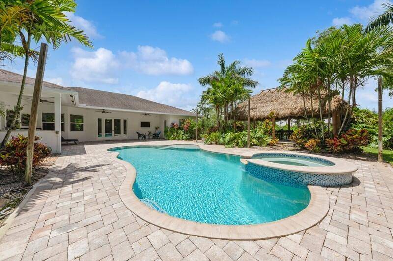 Enjoy a tropical oasis in your own backyard situated in the heart of Northern Palm Beach County.