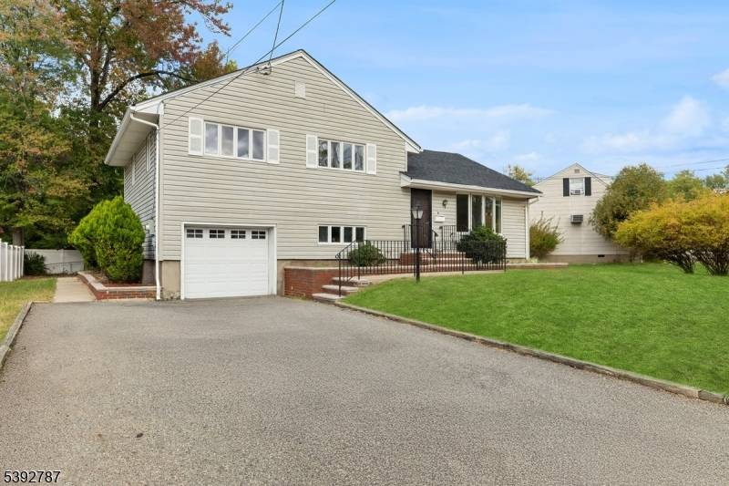 This sun drenched split level home in lively Little Falls offers a perfect mix of style and convenience.