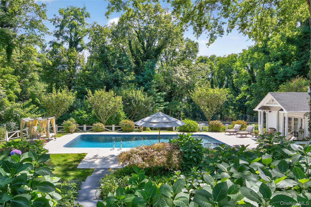 Discover timeless sophistication at 42 Clock Tower Lane, Old Westbury.