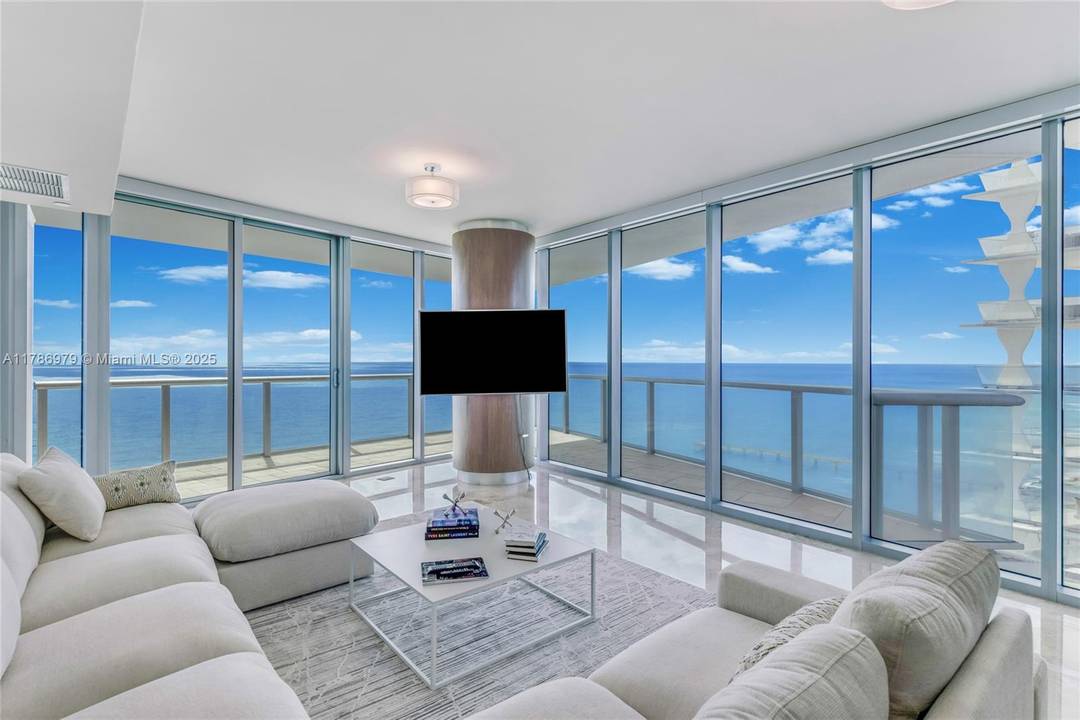 Stunning corner residence with breathtaking direct ocean, intercostal and city views.
