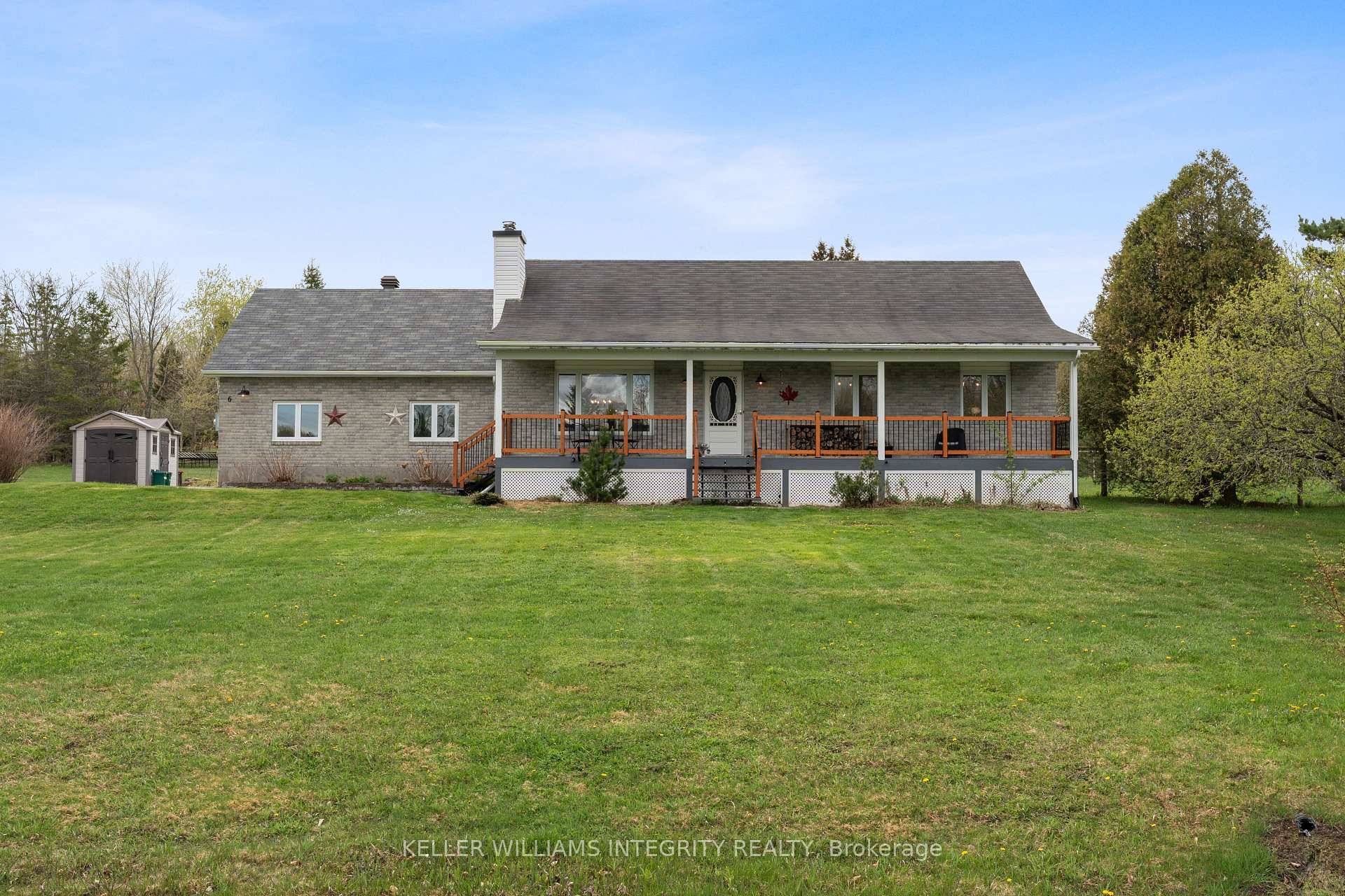 Welcome to this beautifully modernized brick bungalow nestled on a 1.