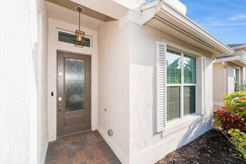 This stunning home in Vero Beach FL offers the perfect blend of Elegance and Smart home functionality with features like a Nest thermostat video doorbell Schlage keyless entry garage door ...