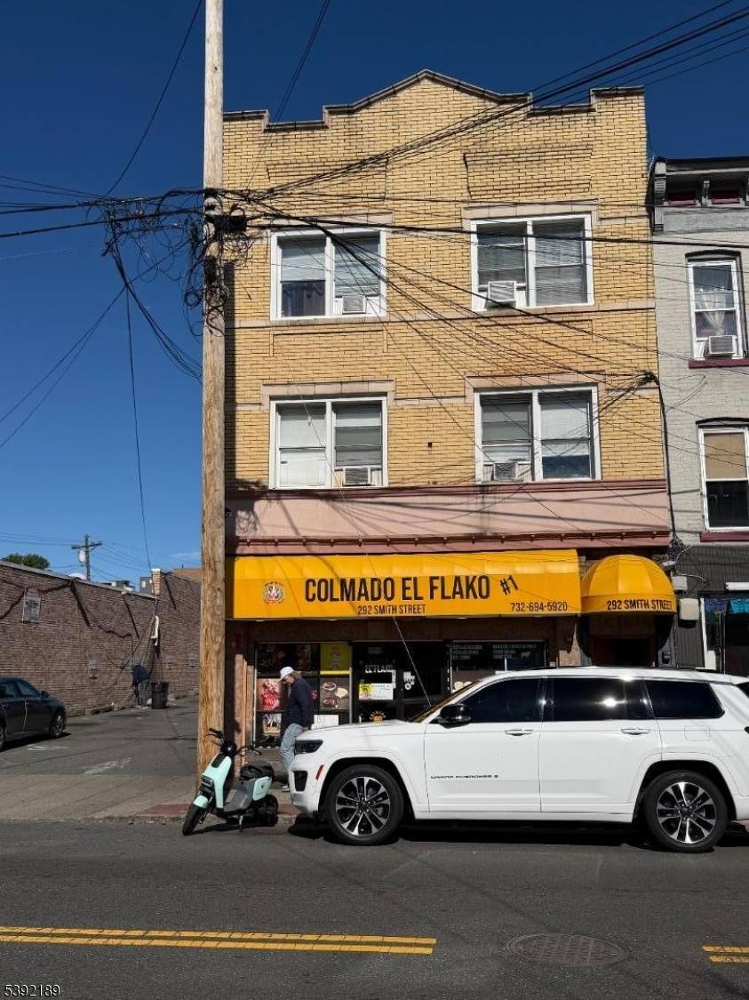 Exceptional mixed use building and business for sale in Perth Amboy's most sought after busiest commercial district.