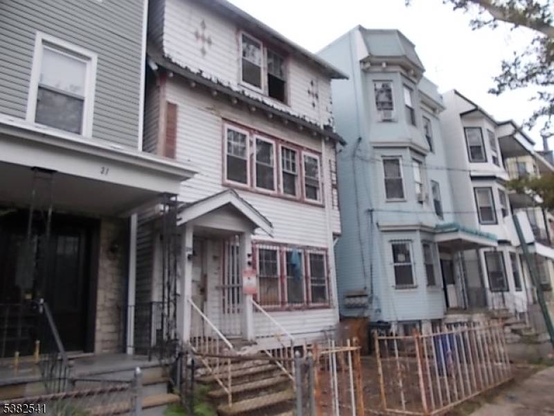 THIS IS A RARE FIND AS PROPERTY IS A LARGE 3 FAMILY WITH MANY POSSIBILITIES AS WELL AS A DETACHED GARAGE AND OFF STREET PARKING.