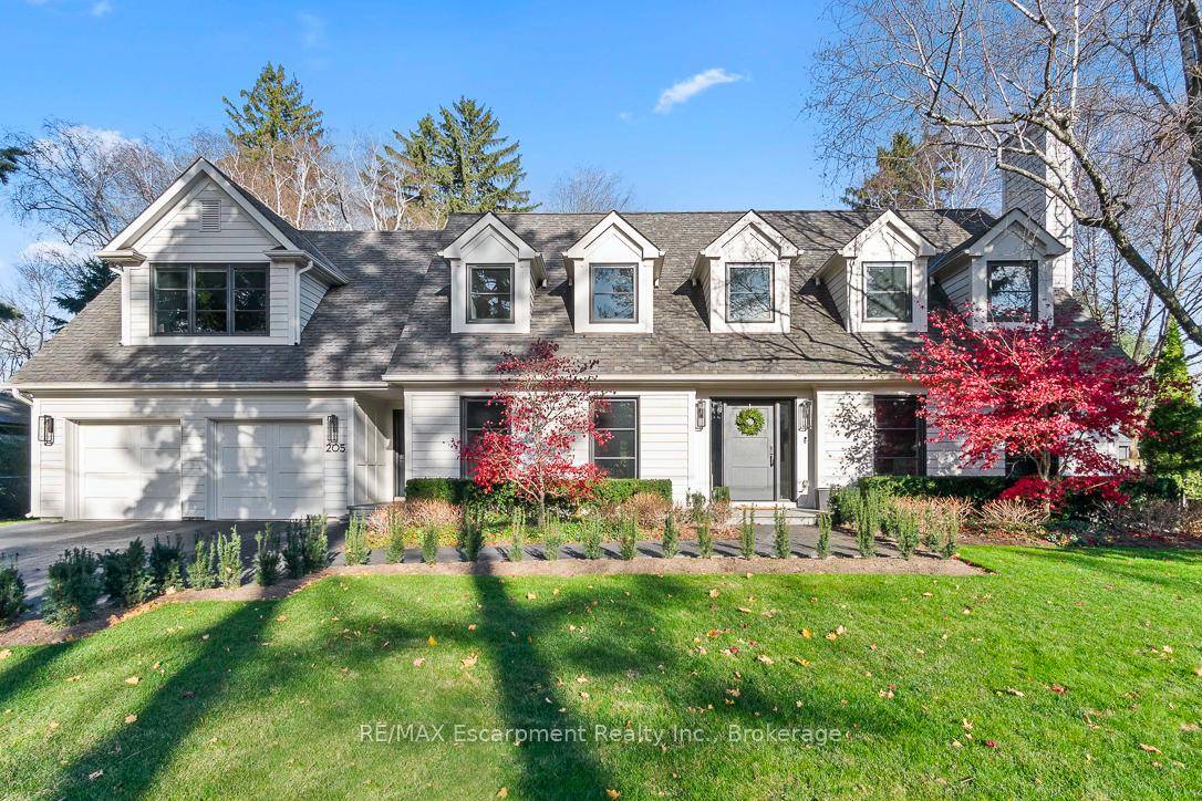 Welcome to 205 Forestwood Drive, a charming Cape Cod inspired home nestled on a serene 120 x 134 ft lot in the heart of SE Oakville's prestigious Morrison neighborhood.