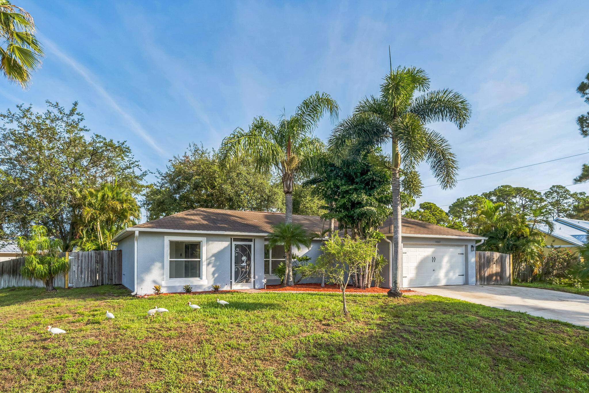 BRAND NEW ROOF BEING INSTALLED'' Vaulted ceilings, split floor plan, NEWER BUILT in 2002 solid concrete block construction with stucco on top.