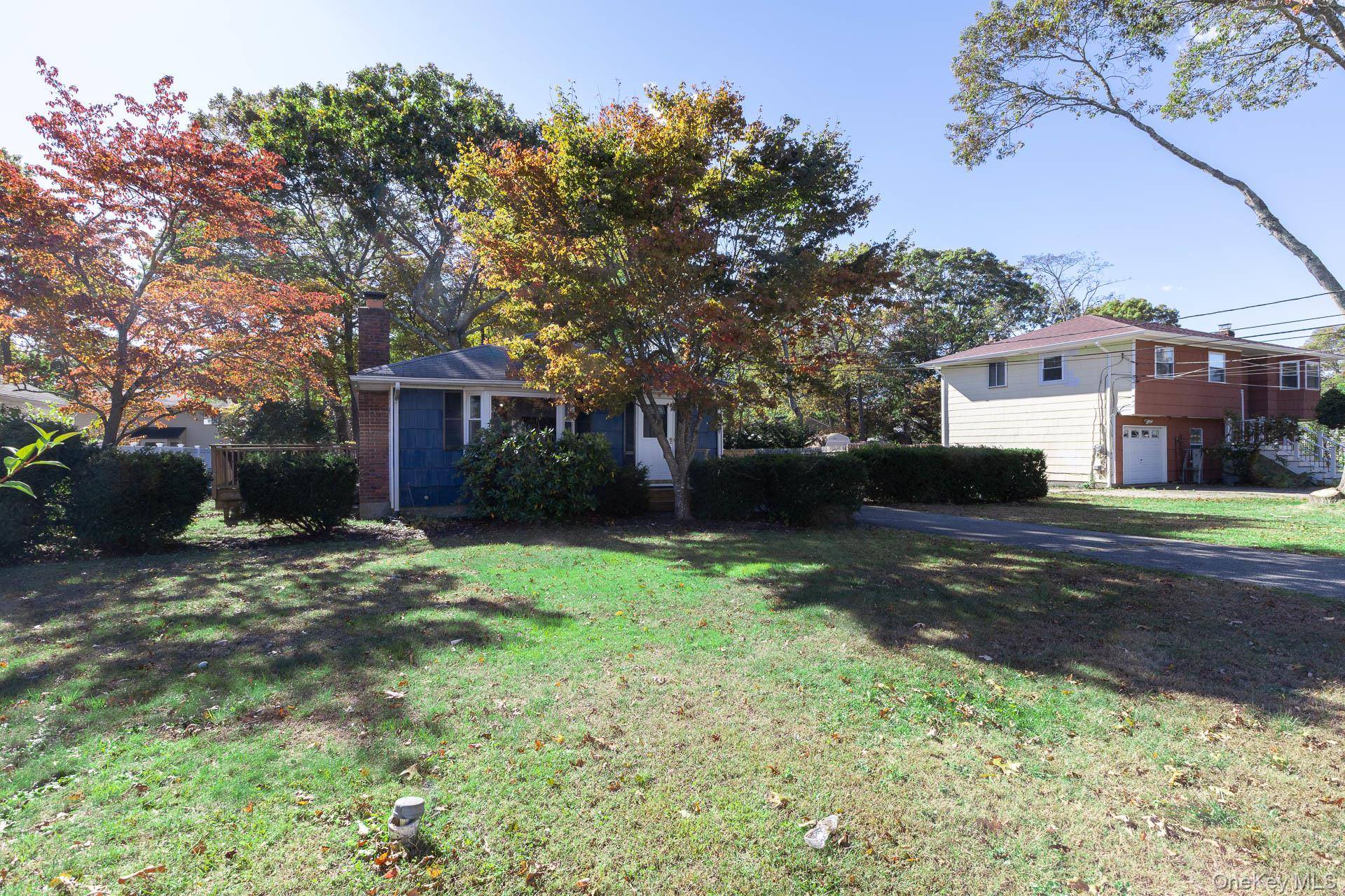 Low Taxes, Turn Key Ranch in Eastport South Manor School District with Wood Burning Fireplace and a Full Basement.