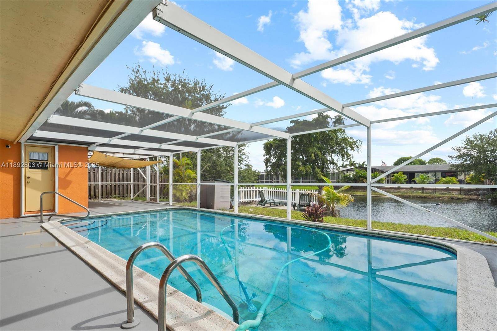 Welcome to your waterfront oasis in Sunrise Golf Village !