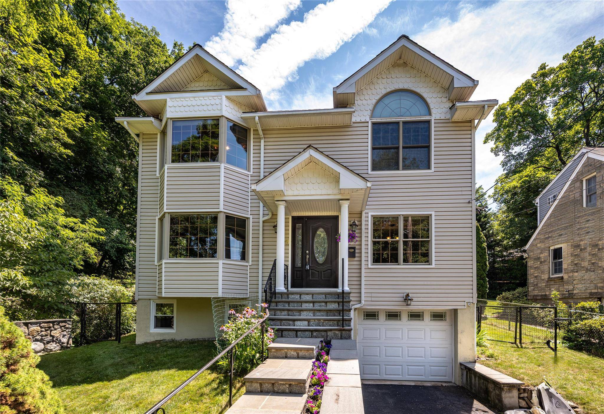 Nestled at the end of a quiet dead end street with seasonal Hudson River views, this beautifully maintained 3 bedroom, 2.