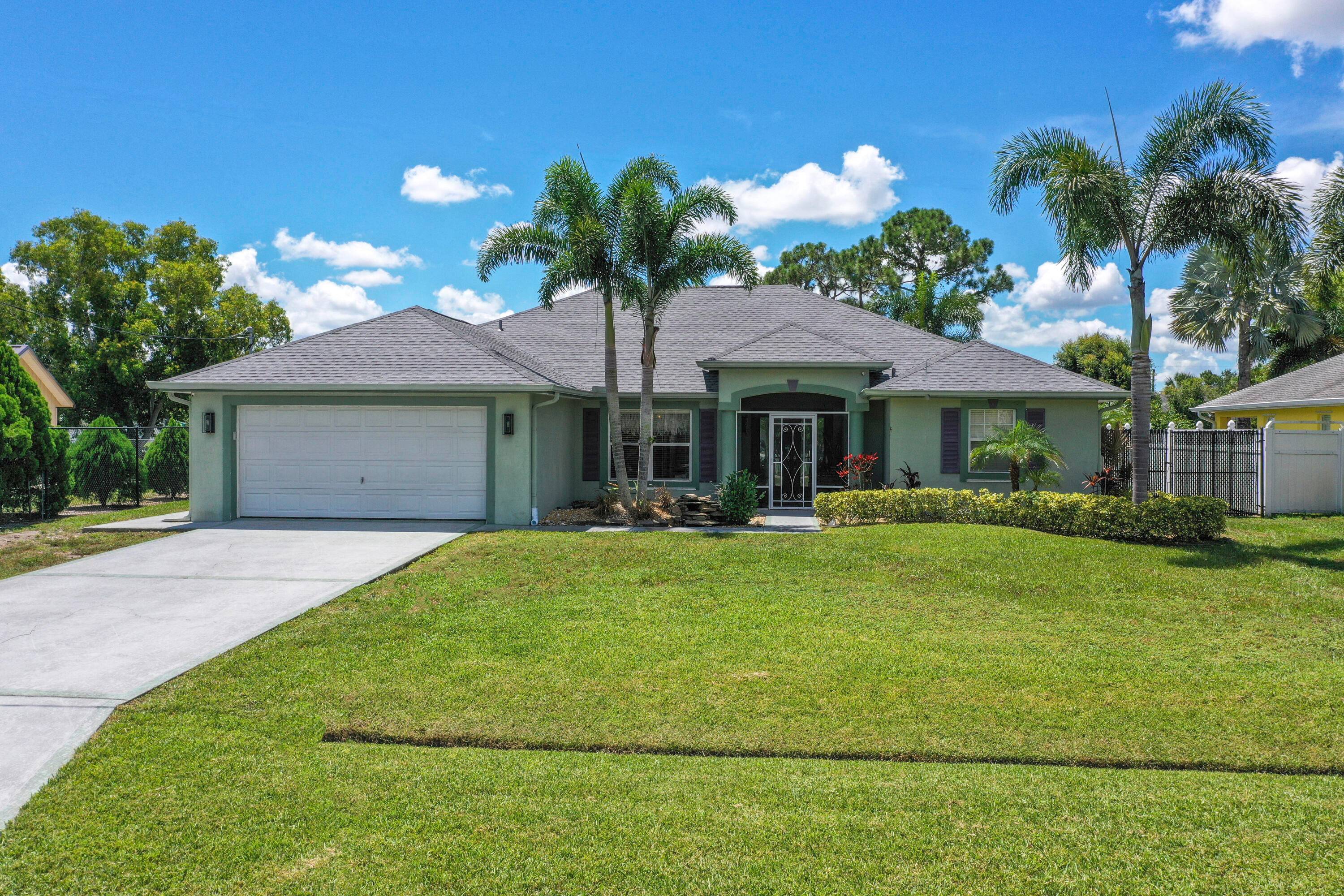 NEWLY INSTALLED ROOF ON THIS MOVE IN READY 3 2 2 HOME LOCATED IN THE HEART OF PSL.