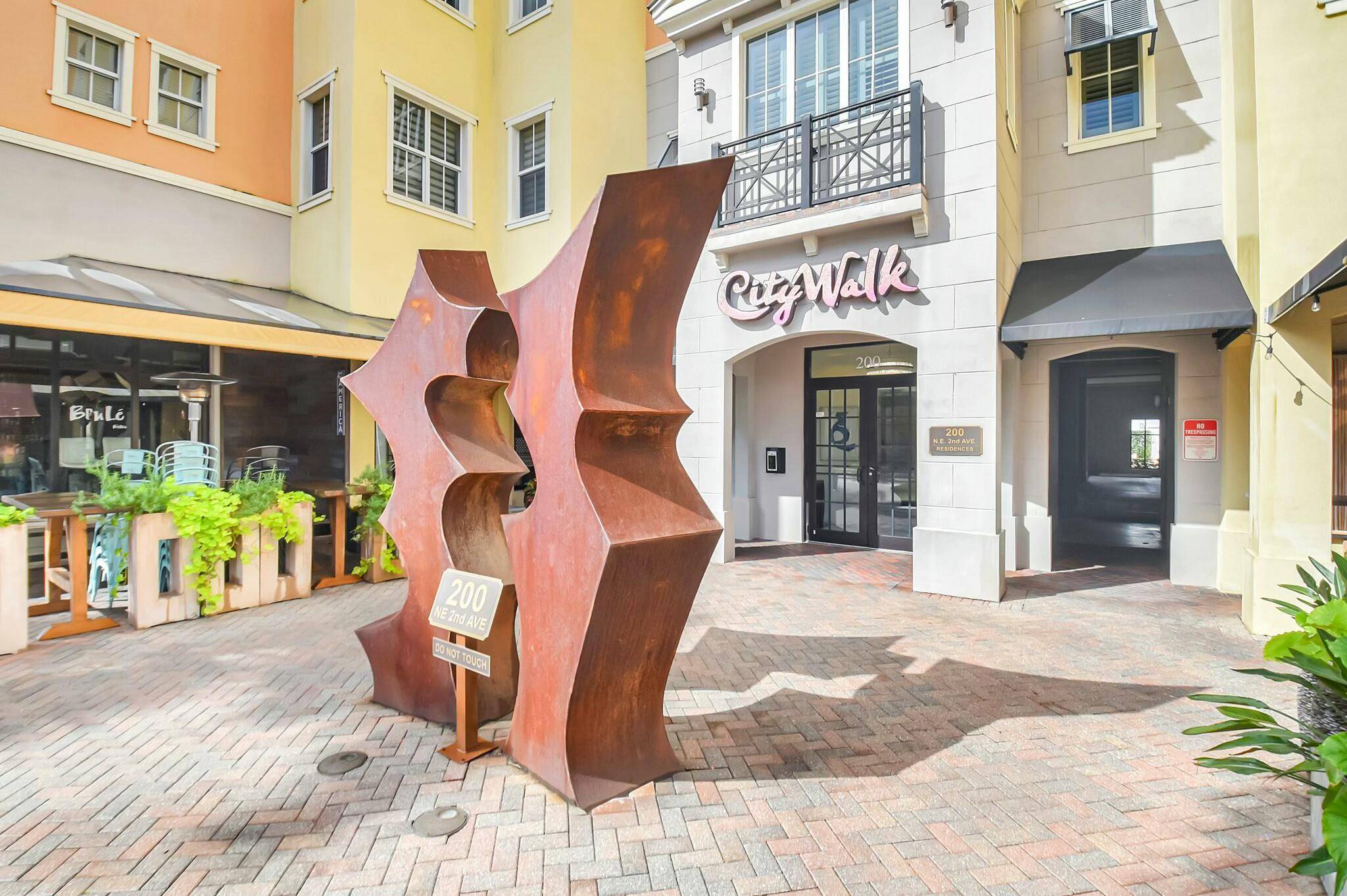 Rarely available corner unit in City Walk Pineapple Grove's most prestigious building 2 blocks from Atlantic Ave.