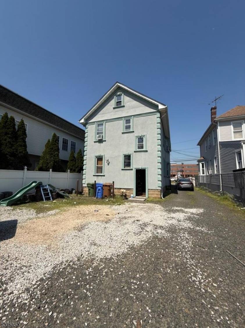 Mixed use commercial space featuring a 3 bedroom apartment on the second floor and a 4 car garage.