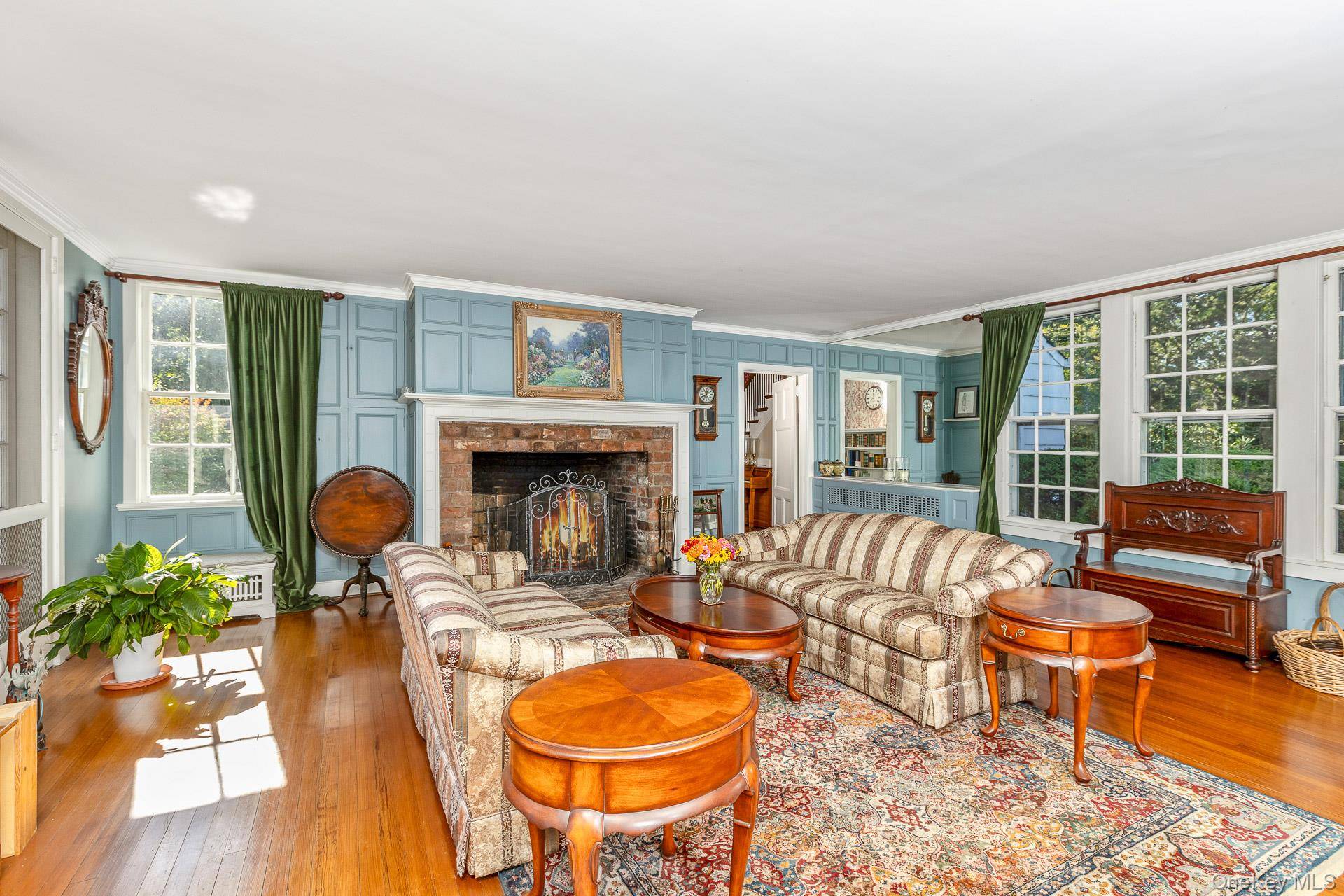 Nestled on two magnificently wooded acres, this distinguished Colonial masterpiece stands as a testament to architectural excellence and timeless sophistication.