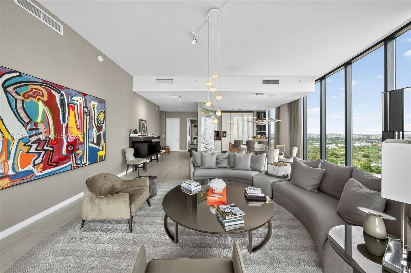 Positioned on a premier penthouse level, this residence showcases sweeping views of Biscayne Bay from its spacious, elegantly designed interiors.
